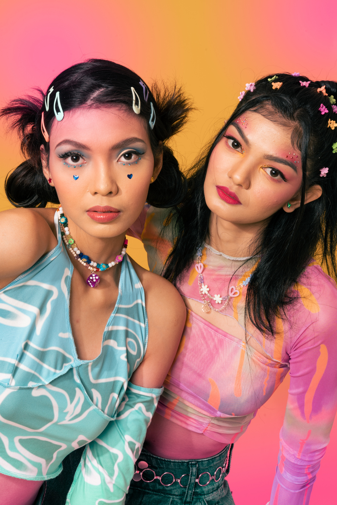 Portrait of Two Women in Retro Outfit on Multicolored Background